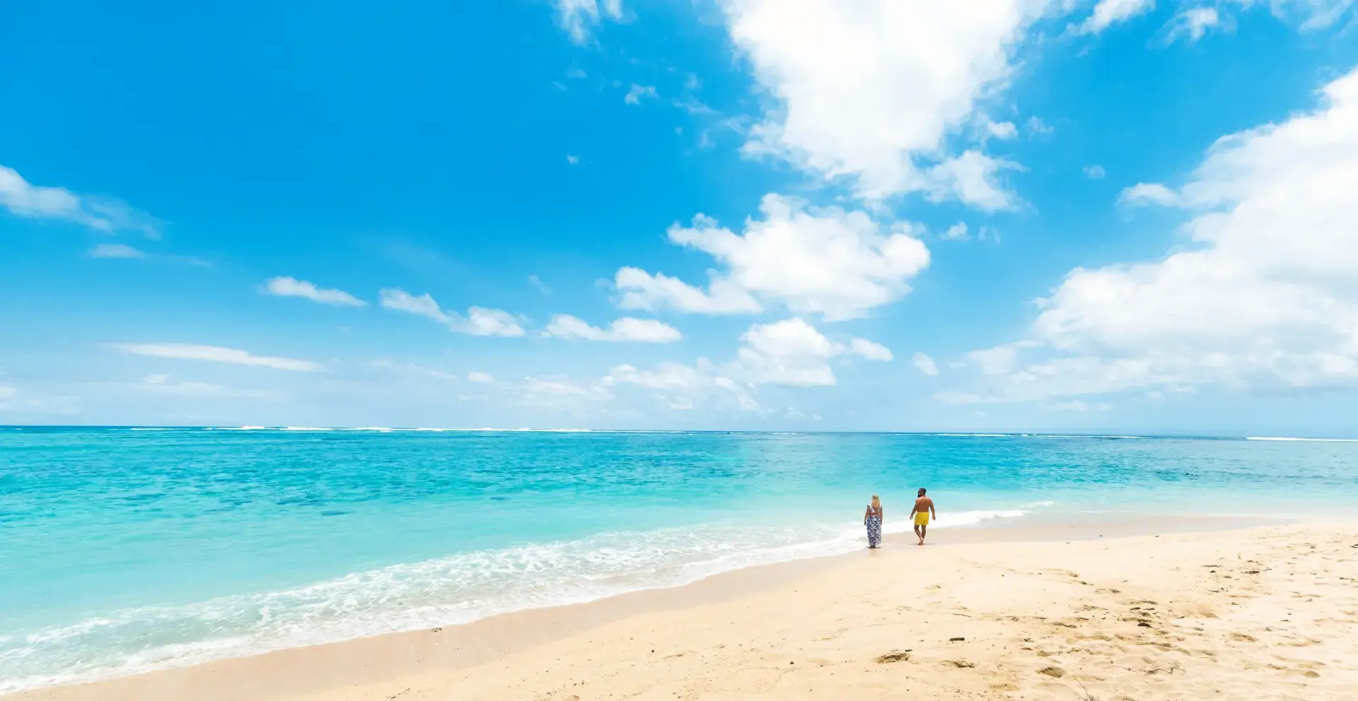 Couple walking in the beach