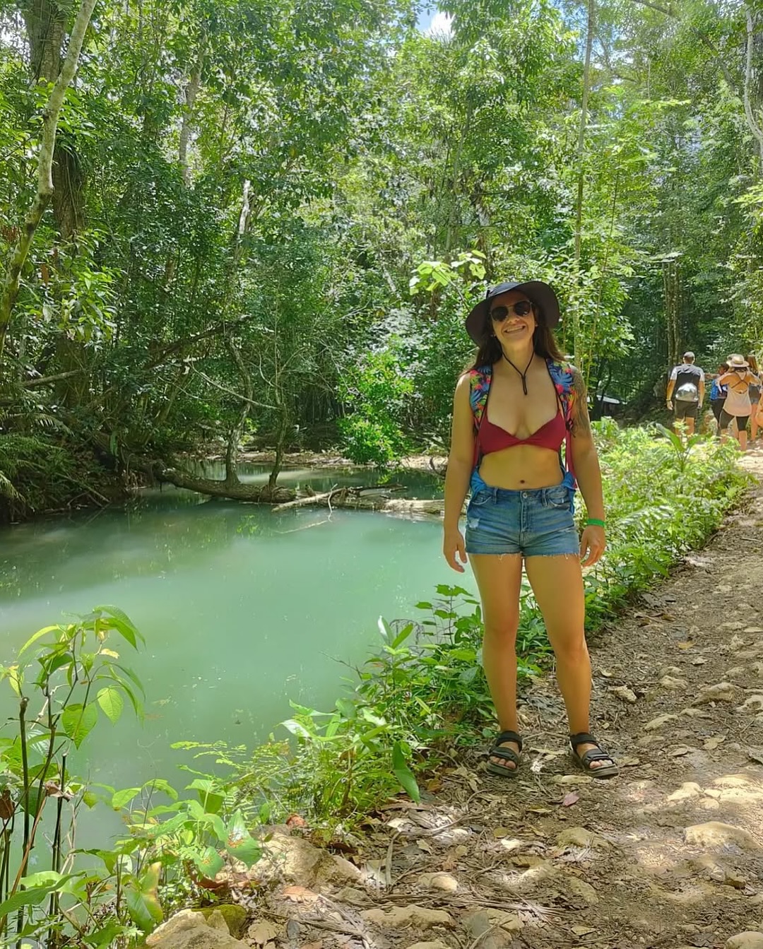 Girl posing for a photo at a lake